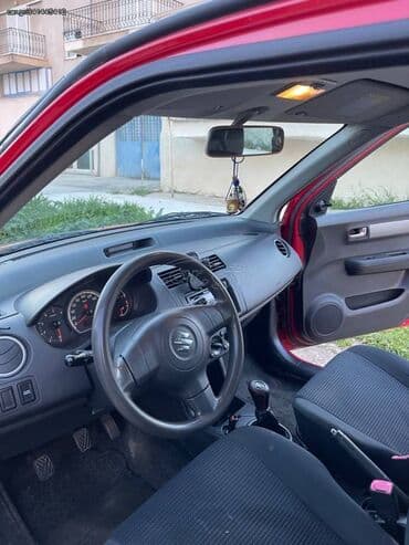 Transport: Suzuki Swift : 1.3 l | 2009 year 150841 km Hatchback — 6