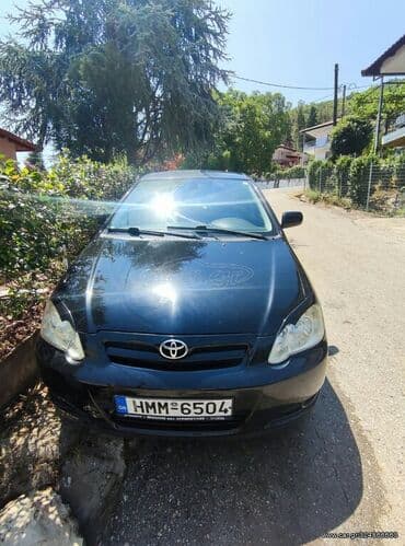 Toyota Corolla: 1.4 l | 2006 year Hatchback — 2